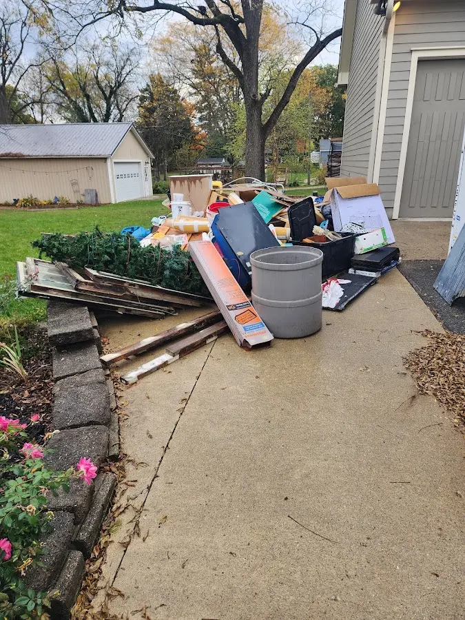 Dumpster being loaded with debris for Roofing Dumpster Rental in Plaistow